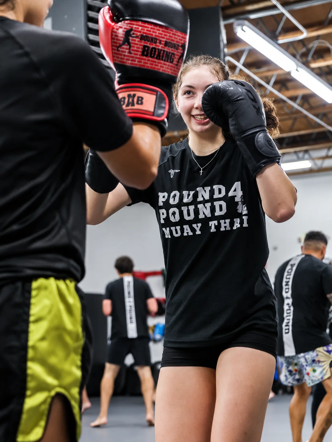 Woman training Muay Thai at Pound 4 Pound in Littleton, Colorado